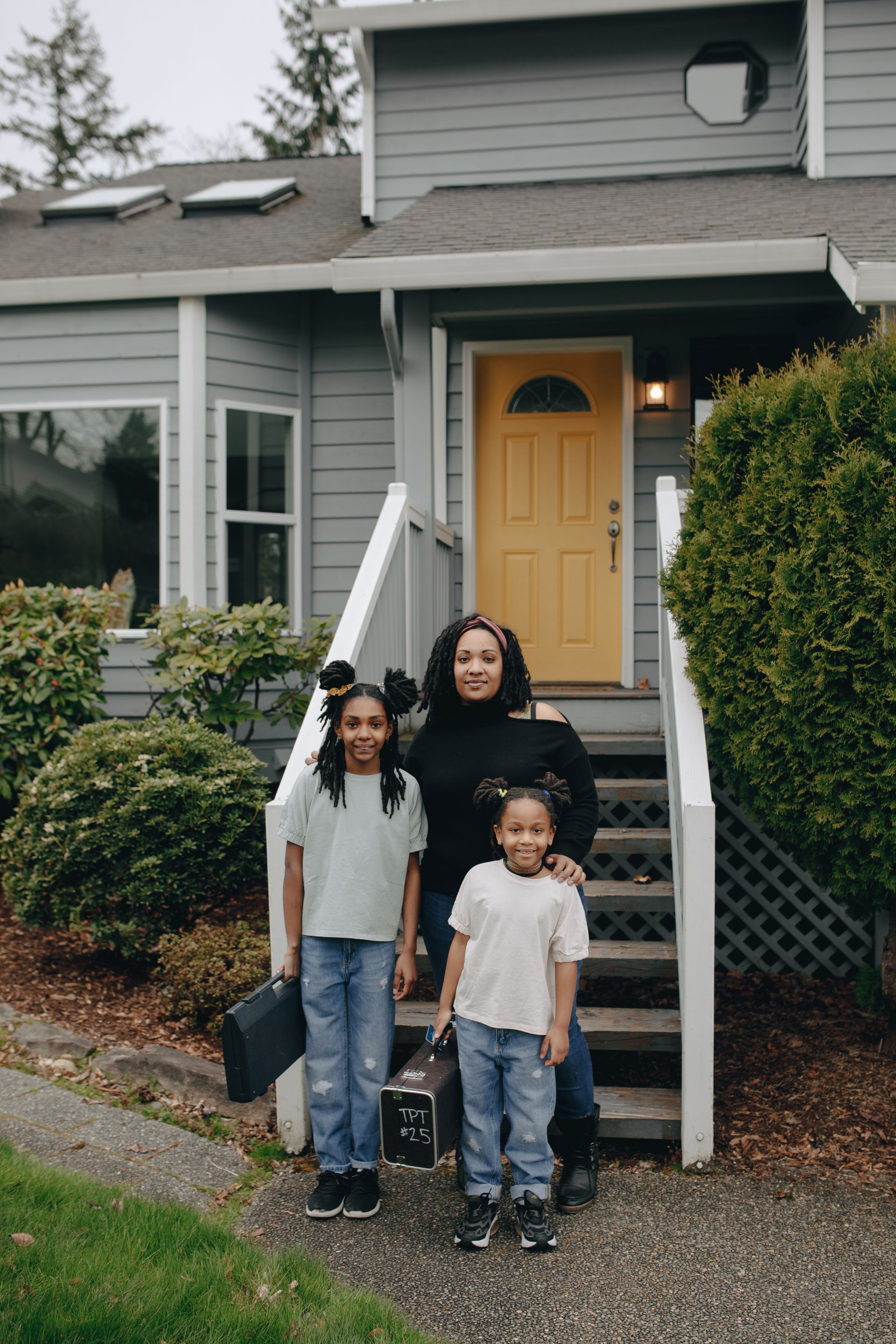 A happy family together outside their home